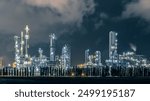 Refinery Oil and Gas Power Energy Industrial at Twilight, Oil Refinery And Petrochemical Plant Pipeline Steel, Refinery Factory Oil Storage Tank And Pipeline Steel At Night.