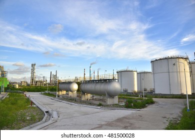 Refinery Storage Tanks And Containers Of Ethanol Under The Blue Sky White Clouds