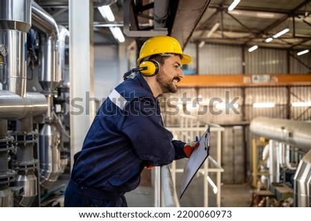 Refinery supervisor working night shift.