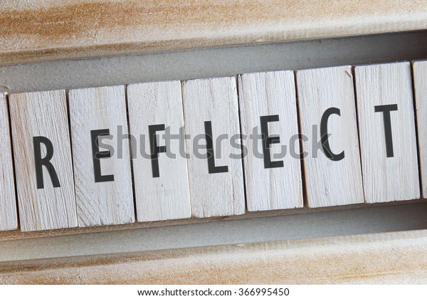 REFLECT word written on wooden