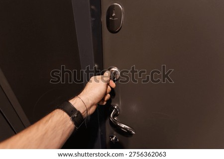 Reflected light highlights texture as door unlocks smoothly