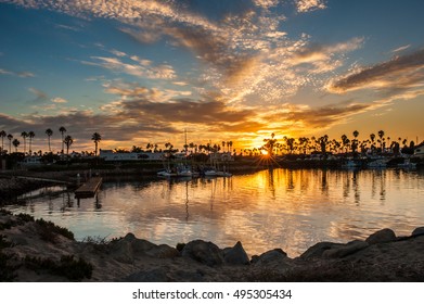 Reflected sunrise in Ventura Marina water at dawn.