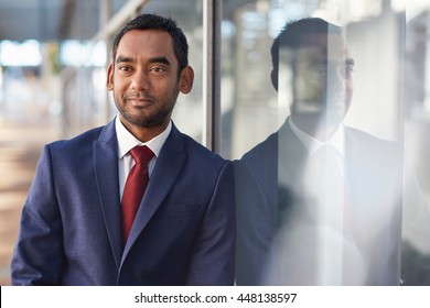 Reflecting on his business success - Shutterstock ID 448138597