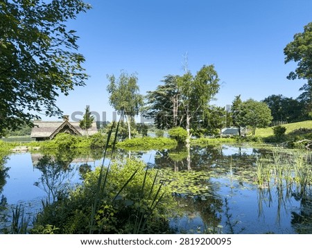 reflecting pond with small buliding next to bay