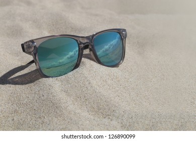 Reflecting Sunglasses On The Beach