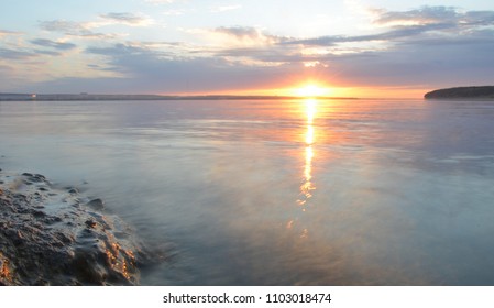reflection of blue sky with white clouds in water, abstract background