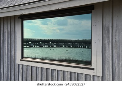Reflection of a bridge in a window