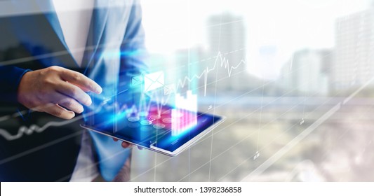 Reflection Businessman using tablet analyzing data and economic growth graph chart and copy space. Concept on tablet with hologram. - Shutterstock ID 1398236858