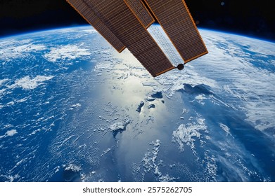 The reflection captures the aweinspiring view from space. Space satellite over the planet earth. Shooting the earth from space. Spaceships in space. Elements of this image furnished by NASA