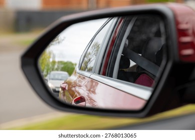 Reflection in a car wing mirror 
