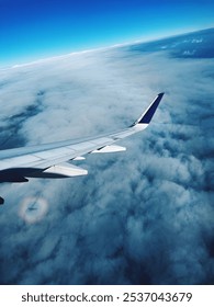 Reflection in the clouds. Flying over the ocean