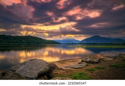 Reflection of clouds in a mountain lake. Mountain lake view. Lake shore in mountains. Beautiful lake landscape