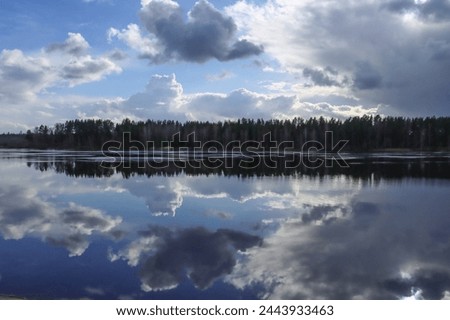 Reflection of clouds on the River Daugava in Ogre, Latvia