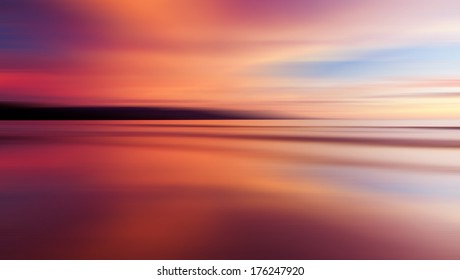 Reflection of colorful sunset with long exposure effect, motion blurred