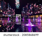 Reflection of colors on water fountains and screens that display beautiful shapes in Riyadh City Boulevard