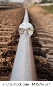 reflection of a crystal ball on the train track