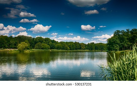 The reflection of the Cumulus clouds in the lake - Powered by Shutterstock - Get 15% off with code: PIKWIZARD15