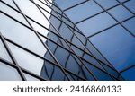 reflection with distortion in the window of a modern building color blue abstract urban background