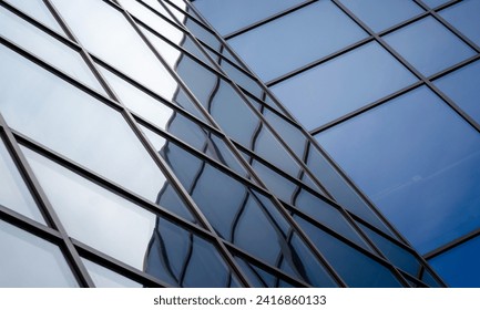 reflection with distortion in the window of a modern building color blue abstract urban background