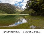 Reflection of Emily Peak in Lake Mackenzie at the famous Routeburn Track, Fjordland National Park, Southland/New Zealand