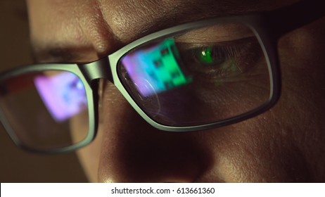 Reflection At Eyeglasses Of Man: Looking At A Website