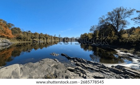 Reflection of fall foliage on the St Francois River 