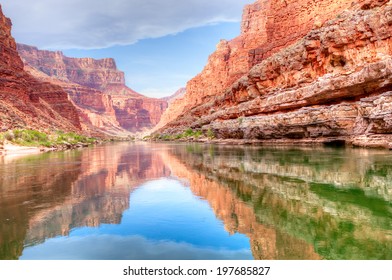 Reflection Of Grand Canyon In Colorado River.