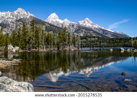 Reflection of the Grand Tetons in Taggart Lake, Jackson Hole, Wyoming, horizontal