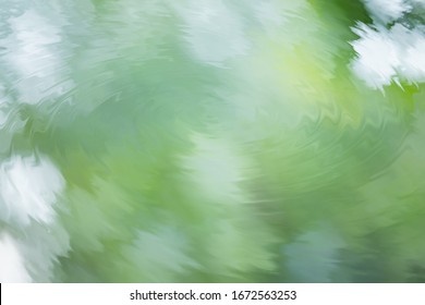 Reflection Of Green Leaf And Cloudy Sky On Water Ripple. Abstract Nature Background.