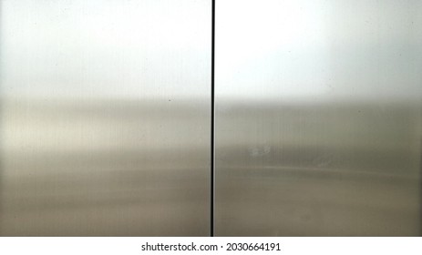 Reflection Of Light On A Shiny Metal Texture,stainless Steel Panel Background,silver Space Backdrop.