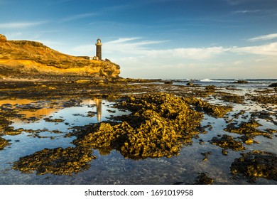 reflection of the lighthouse in the water