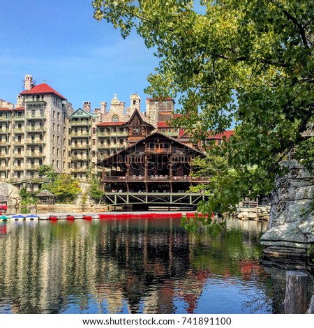 Reflection of Mohonk Mountain House wooden pavilion in a lake in New Paltz, New York