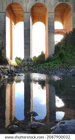 Reflection of Mosta bridge after rain. 