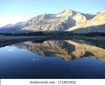 reflection of mountain in lake