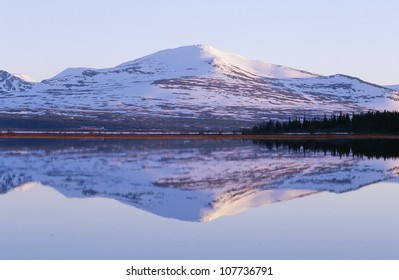 Reflection of mountain and trees in lake