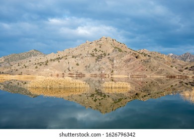 The reflection of mountains on a lake.