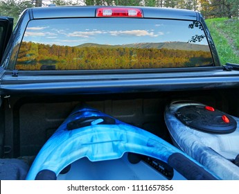 Reflection Of Mountains In Truck Window, Canada