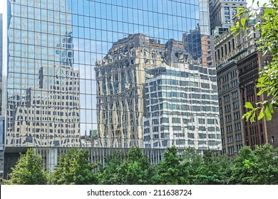 Reflection of New York City architecture from the side of a glass building in lower Manhattan.