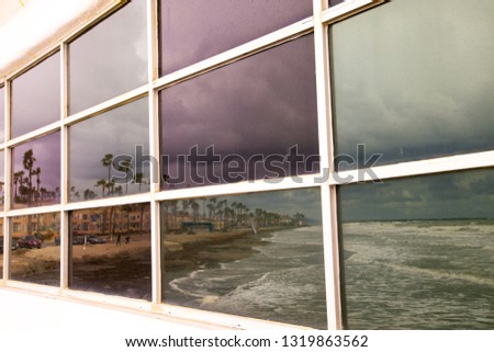reflection of ocean in window (oceanside)