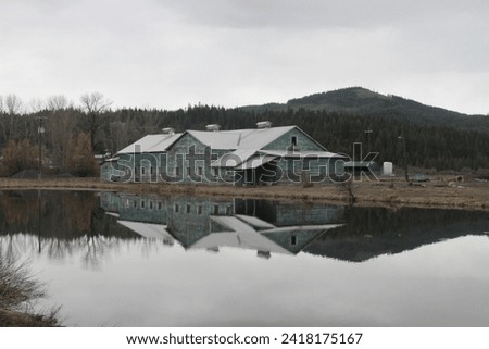 reflection of the old mill building in the pond at Elk River Idaho
