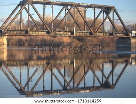 Reflection of old train bridge over the Snake River in Blackfoot, Idaho