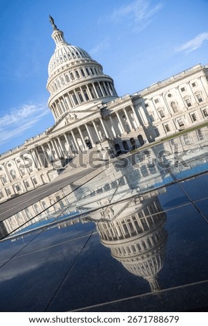Reflection on the wet marble in front of the United States Capitol