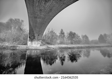 
Reflection Of The Perspective Of The Concrete Bridge Over The Canal