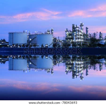 Reflection of petrochemical industry on sunset colorful sky