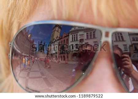reflection of Prague in glasses 