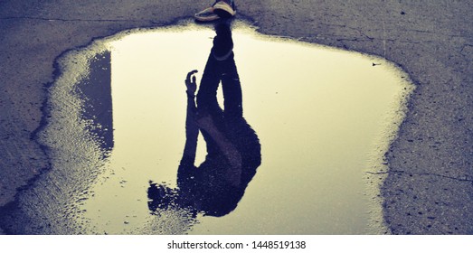 reflection in puddle on road