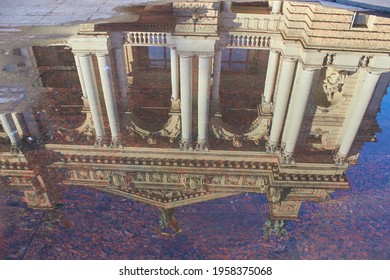 reflection in a puddle opera house,on the pavement in a puddle of reflection Lviv Opera House