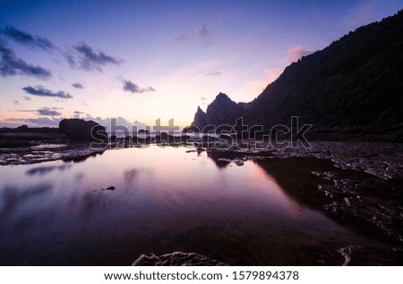 The reflection of purple sunset sky