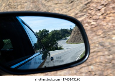 Reflection Of Road In Car Sideview Mirror