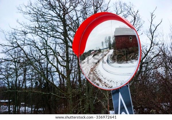 Reflection of road and farm in the traffic safety\
mirror, Norway
